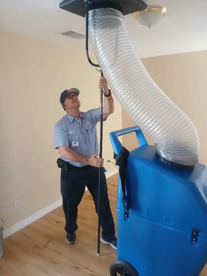 Furnace Tune-Up technician using HEPA equipment in Goldsboro
